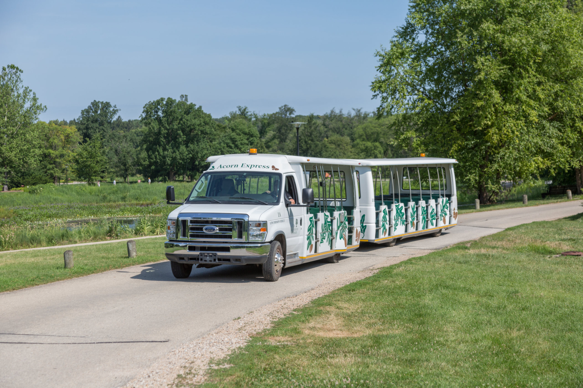 Photograph of Acorn Express Tram Tour vehicle driving through The Morton Arboretum's East Side