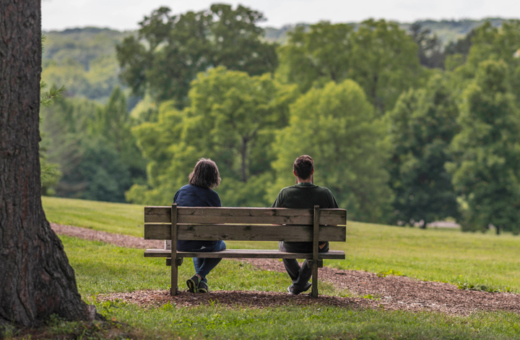 Couple sitting on a bench at Frost Hill in Summer