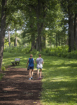 People walk main trail loop 1 in summer