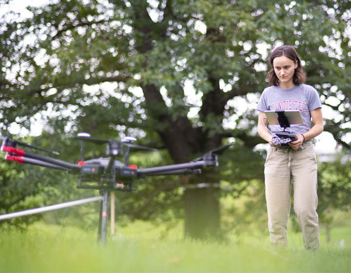 REU student flying a drone