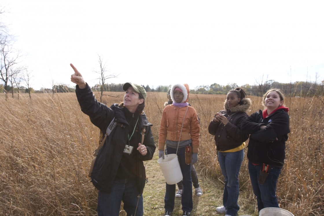Small group of students with teacher in the prairie