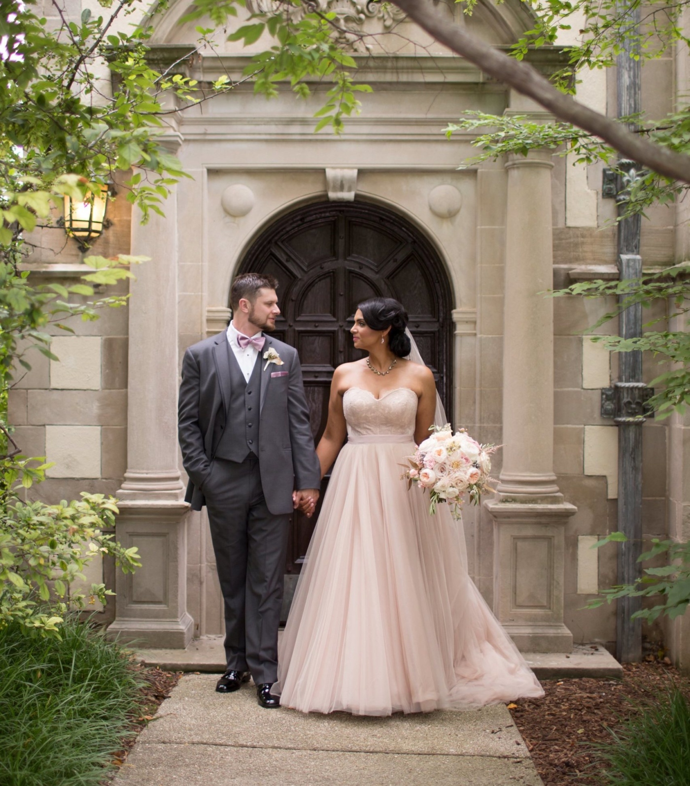 Wedding couple outside a beautiful door at thornhill